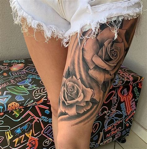 tatuagem feminina de flor na coxa|Tatuagem feminina na coxa com flores: inspirações irresistíveis。